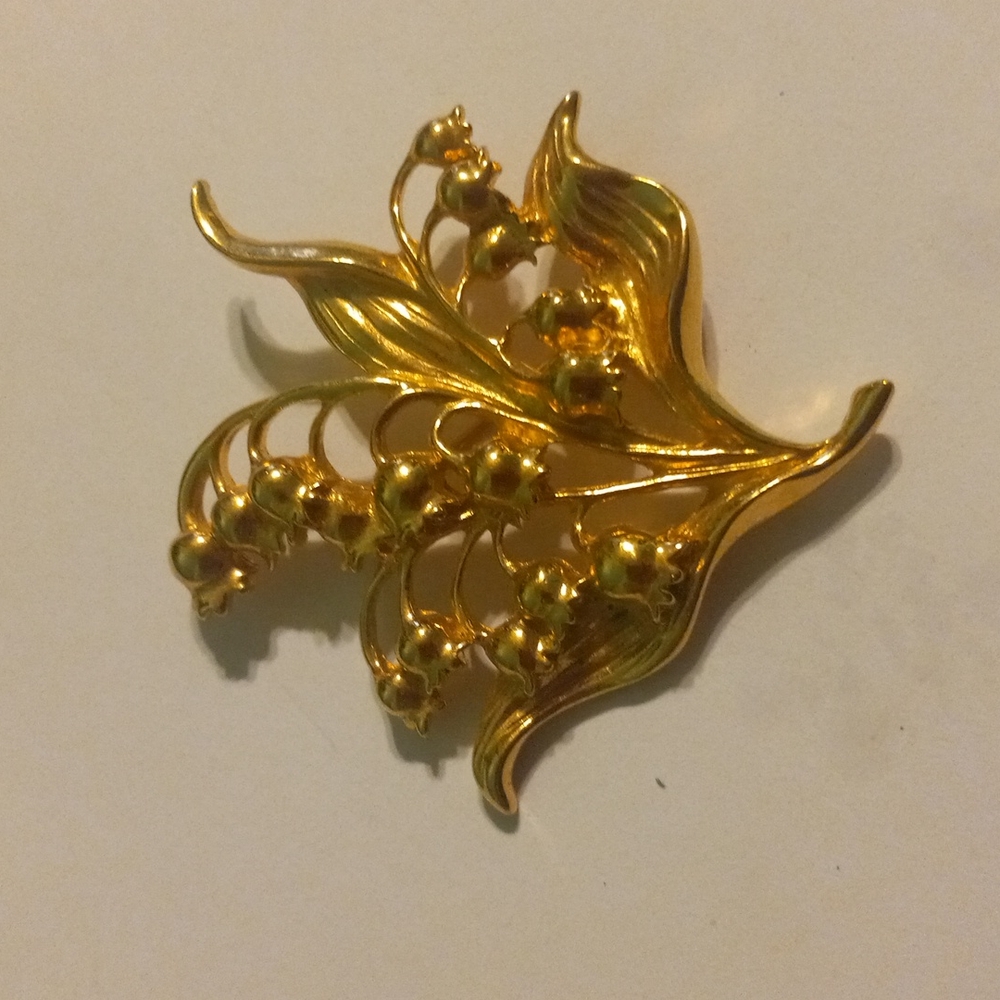 Gold avon pin